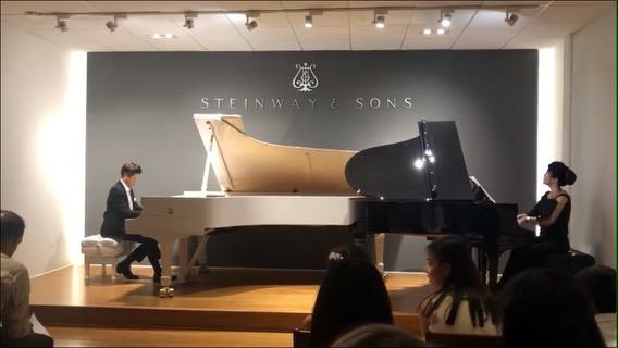 Annie and Richard playing in the Steinway & Sons Gallery